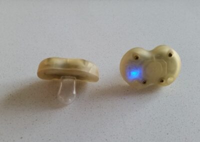 A Smart Pacifier that detects the frequency and strength of a baby suckling and wirelessly tracks on a tablet app.