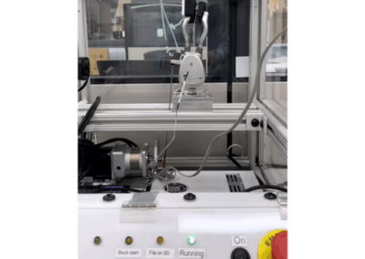 The durability test rig actuates a mechanical prosthetic "hand" to ensure locking and unlocking can withstand use and abuse.